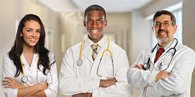 Group of medical staff standing in a hallway.